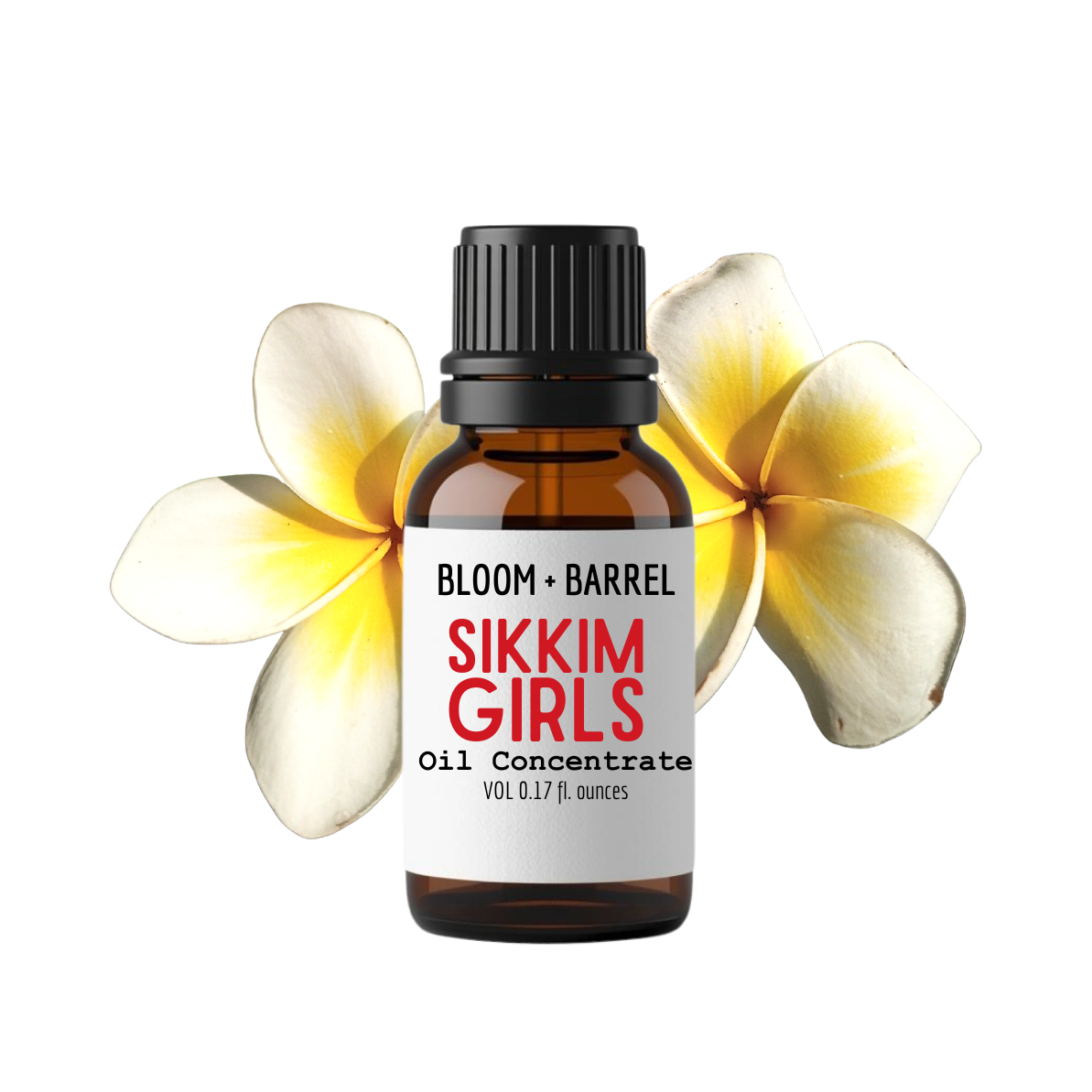 A small amber glass bottle labeled 'BLOOM + BARREL SIKKIM GIRLS Oil Concentrate' with a black cap, centered on a white background and framed by two yellow-and-white plumeria flowers behind it.