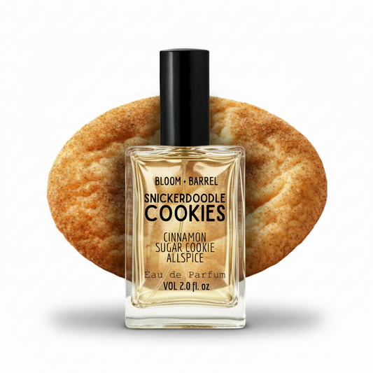 Perfume bottle labeled 'Snickerdoodle Cookies' with a snickerdoodle cookie in the background