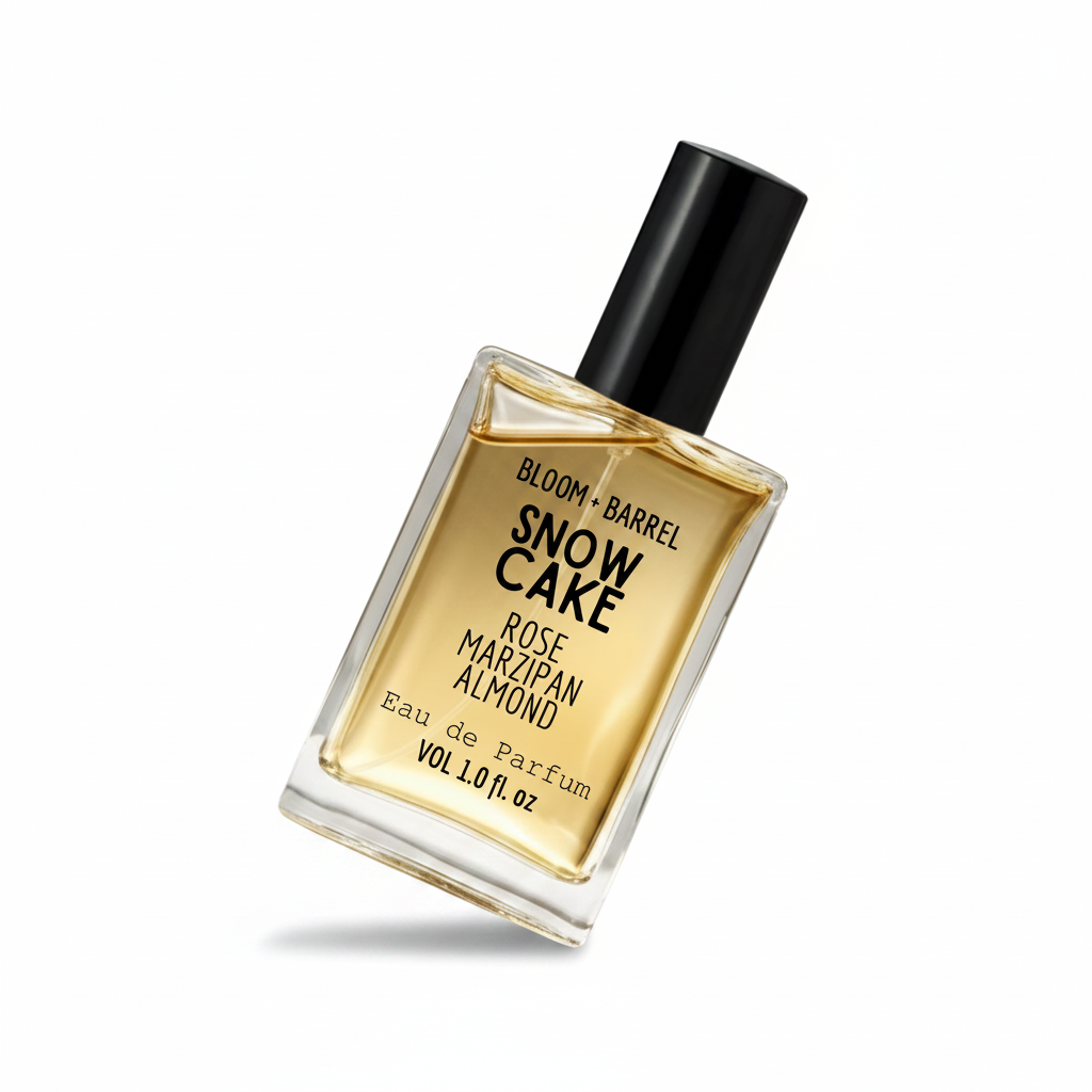 Perfume bottle labeled 'Snow Cake' by Bloom & Barrel on a white background