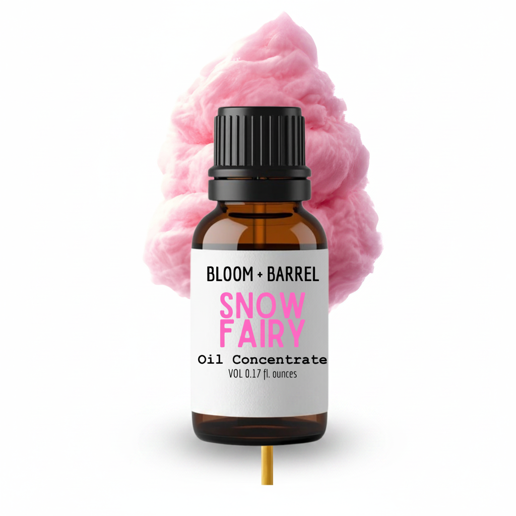 Bottle of Bloom & Barrel Snow Fairy oil concentrate with pink cotton candy in the background