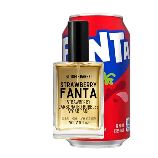 Bloom Barrel Fanta Strawberry Eau de Parfum bottle in front of a red Fanta soda can on a white background.
