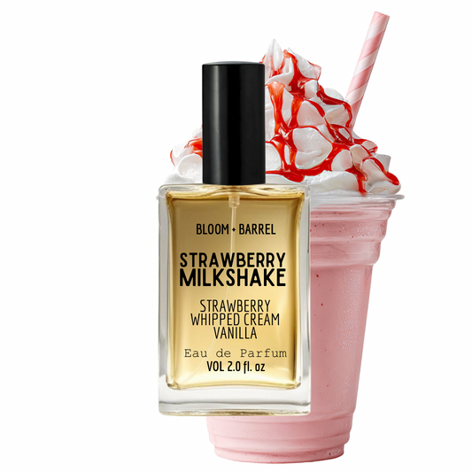 Bottle of Bloom & Barrel Strawberry Milkshake perfume with a pink milkshake and straw on a white background
