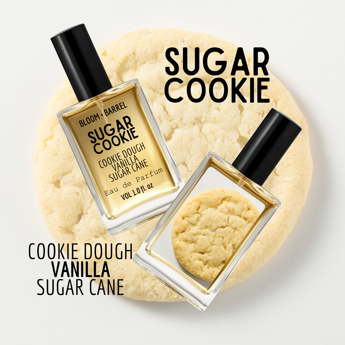 Two perfume bottles labeled 'Sugar Cookie' on a cookie-shaped platform with a white background.