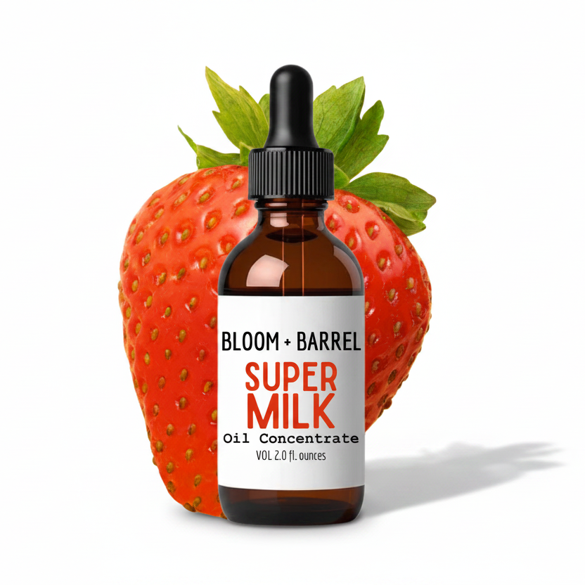 Bottle of Bloom + Barrel Super Milk Oil Concentrate with a strawberry on a white background
