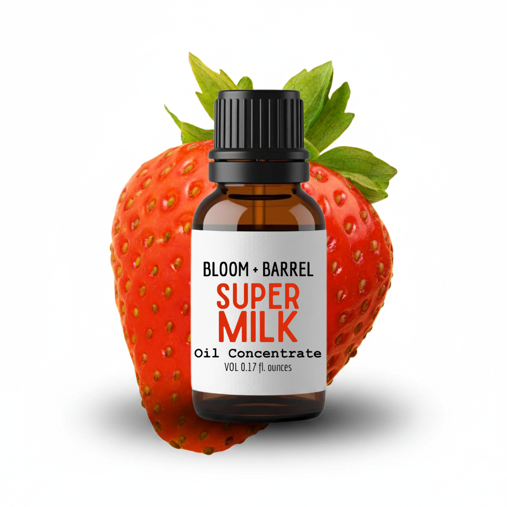 Bottle of Bloom & Barrel Super Milk Oil Concentrate on a strawberry with a white background