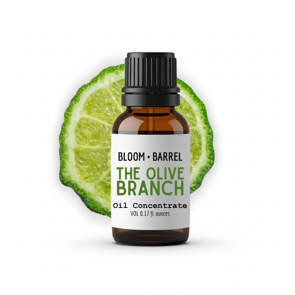 Bottle of 'The Olive Branch' oil concentrate with a lime wedge on a white background