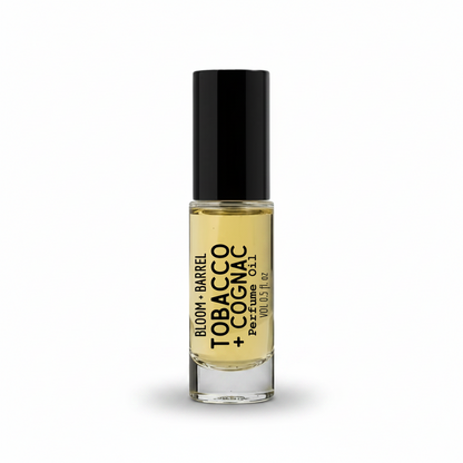 Perfume bottle labeled 'Bloom + Barrel Tobacco & Cognac' on a white background