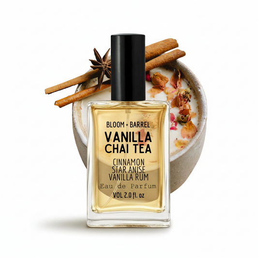 Vanilla Chai Tea perfume bottle with a cup of tea and cinnamon sticks on a white background