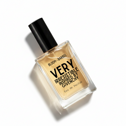 A bottle of Givenchy Bloom + Barrel Very Irresistible Eau de Parfum, featuring a clear glass bottle with amber-colored liquid, a black cap, and bold black text on the front, set against a plain white background.