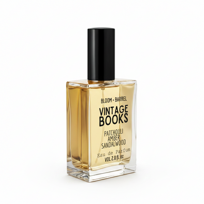 A rectangular glass bottle of Bloom + Barrel Sweet Milk Eau de Parfum with a black cap, filled with golden-amber liquid, on a plain white background.