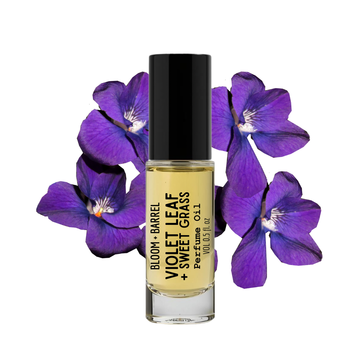 Perfume bottle with 'Violet Leaf + Sweet Grass' label surrounded by purple flowers on a white background