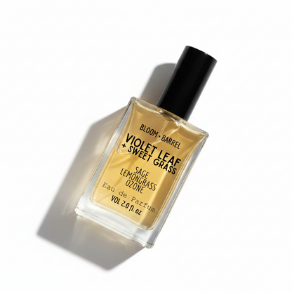 Perfume bottle labeled 'Bloom & Barrel' with 'Violet Leaf + Sweet Grass' on a white background
