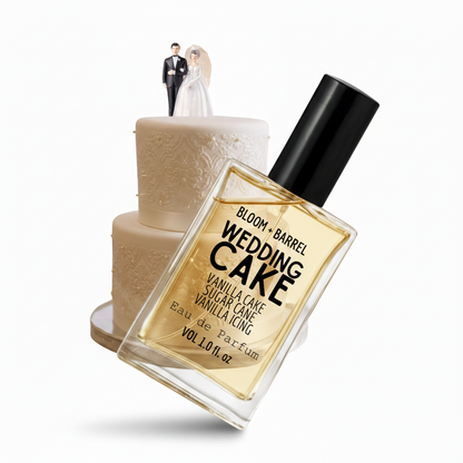 Perfume bottle labeled 'Wedding Cake' with a cake and figurines on a white background