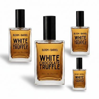 Four glass perfume bottles of Bloom Barrel White Chocolate Truffle Eau de Parfum in different sizes, arranged on a plain white background.