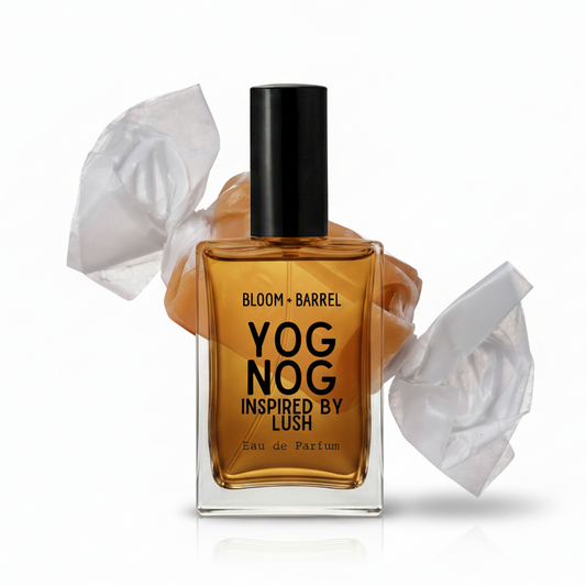 A bottle of YOG NOG Eau de Parfum inspired by Lush, featuring amber-colored fragrance liquid in a clear glass bottle with a black cap, set against a white background with crumpled white tissue paper props.