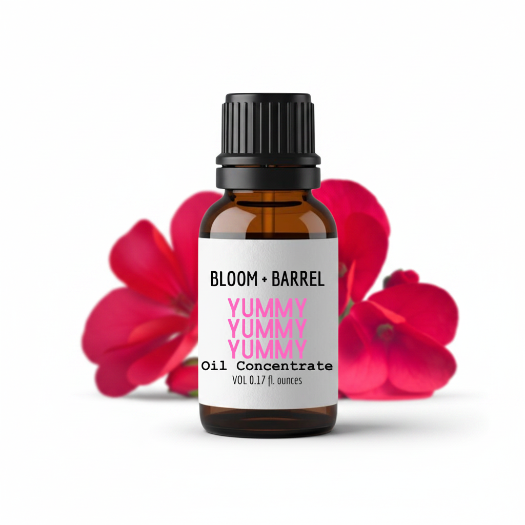 Bottle of Bloom & Barrel Yummy Yummy Oil Concentrate with red flowers in the background