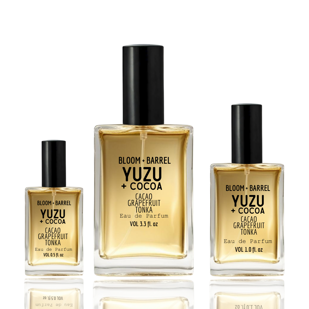 Three bottles of Bloom & Barrel Yuzu + Cocoa perfume on a white background